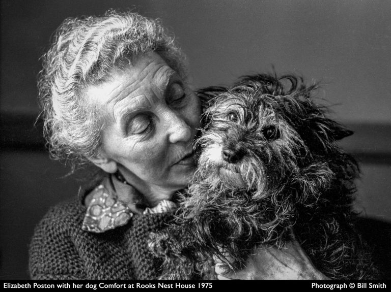 Elizabeth Poston with her dog Elizabeth Poston holds her dog, Comfort, at Rooks Nest House in 1975